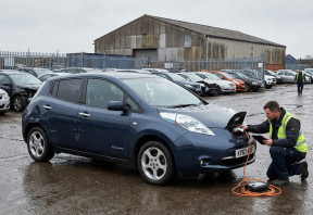 Nissan Leaf being inspected at a salvage vehicle auction.