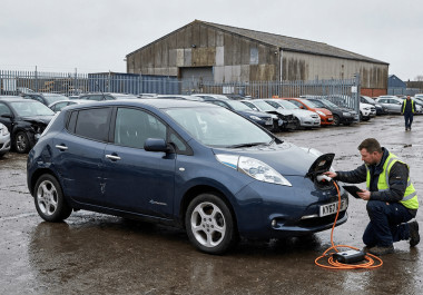 Nissan Leaf being inspected at a salvage vehicle auction.